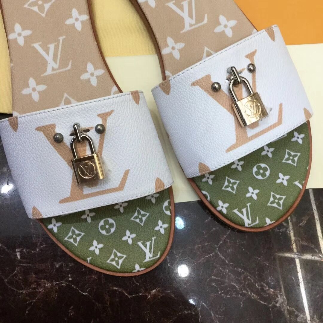 Flache Mules „Lock It“ von Louis Vuitton in Weiß/Mokkabraun - EUR FASHION