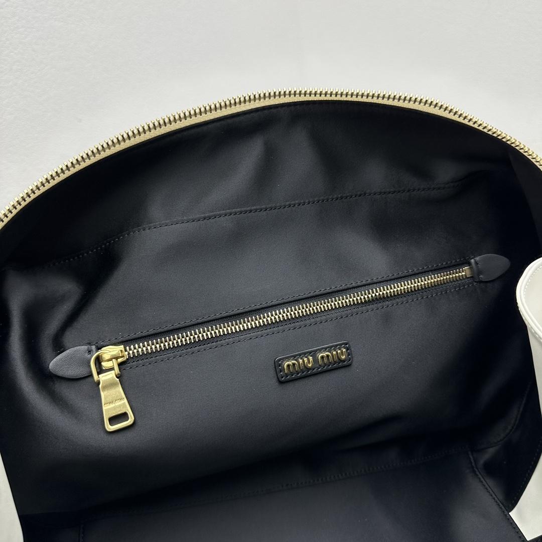Miu Miu Ledertasche mit Henkel - EUR FASHION