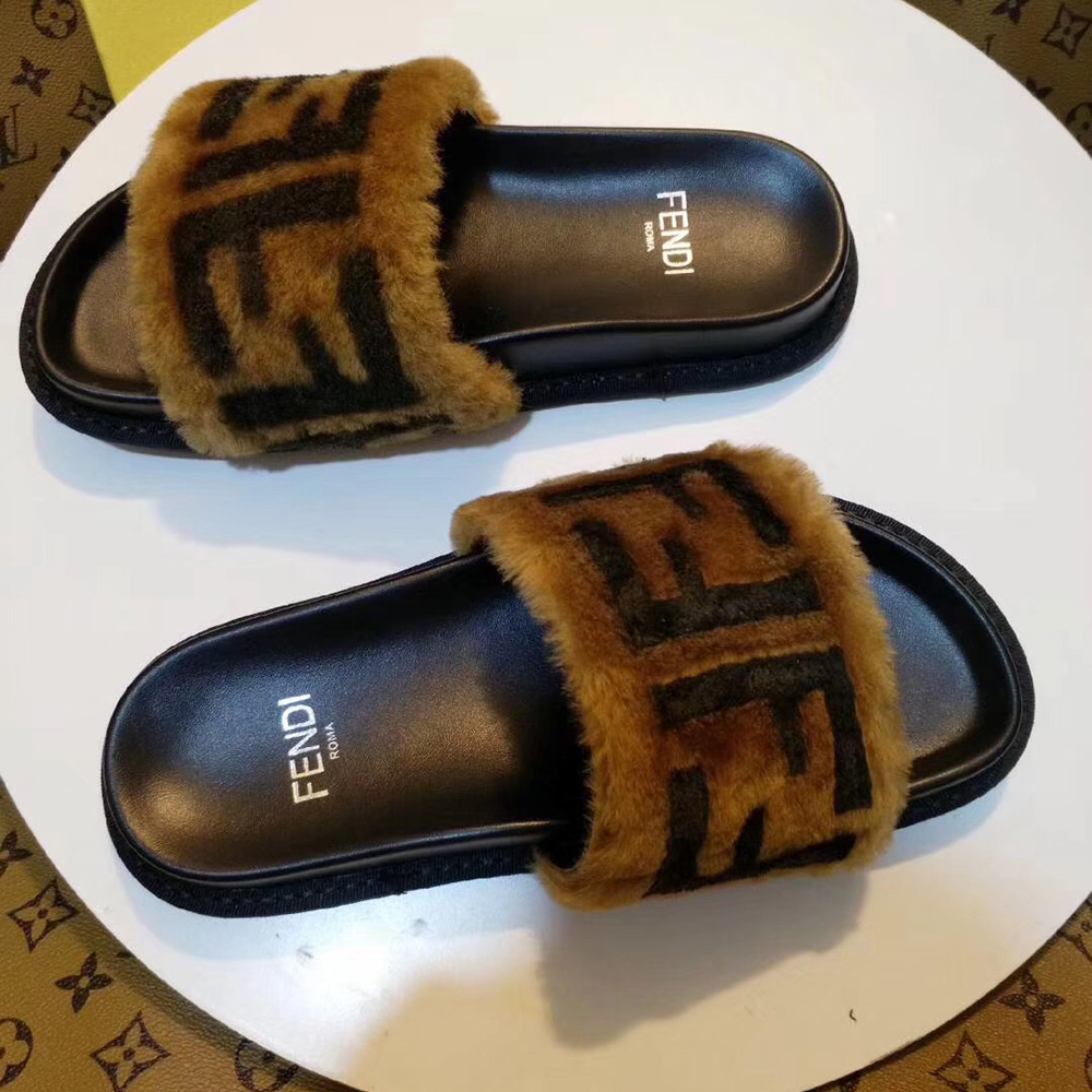 Fendi-Slides aus braunem Leder und Schaffell - EUR FASHION