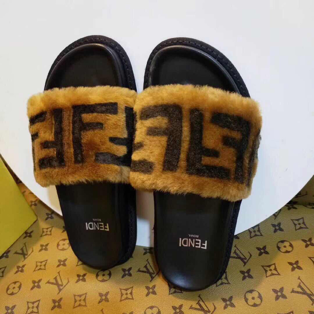 Fendi-Slides aus braunem Leder und Schaffell - EUR FASHION