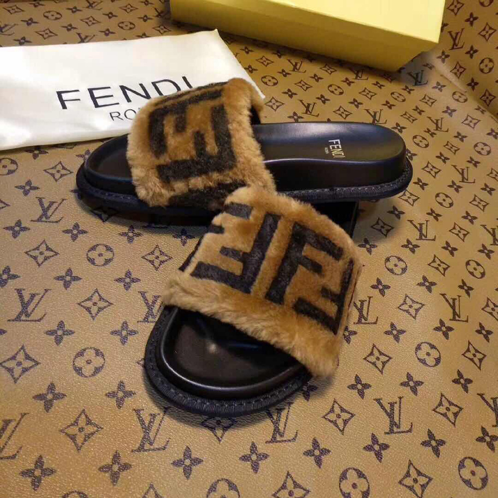 Fendi-Slides aus braunem Leder und Schaffell - EUR FASHION
