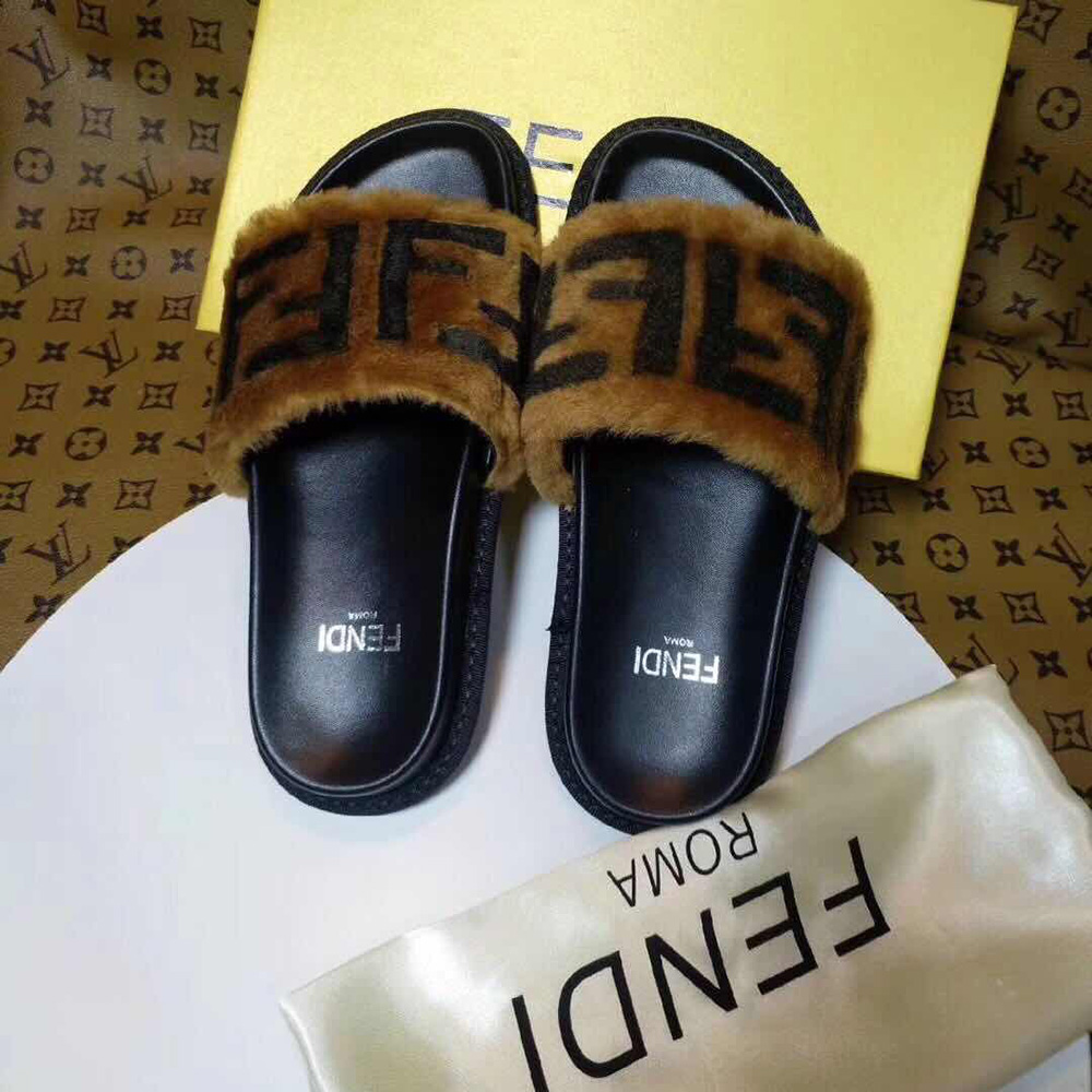 Fendi-Slides aus braunem Leder und Schaffell - EUR FASHION