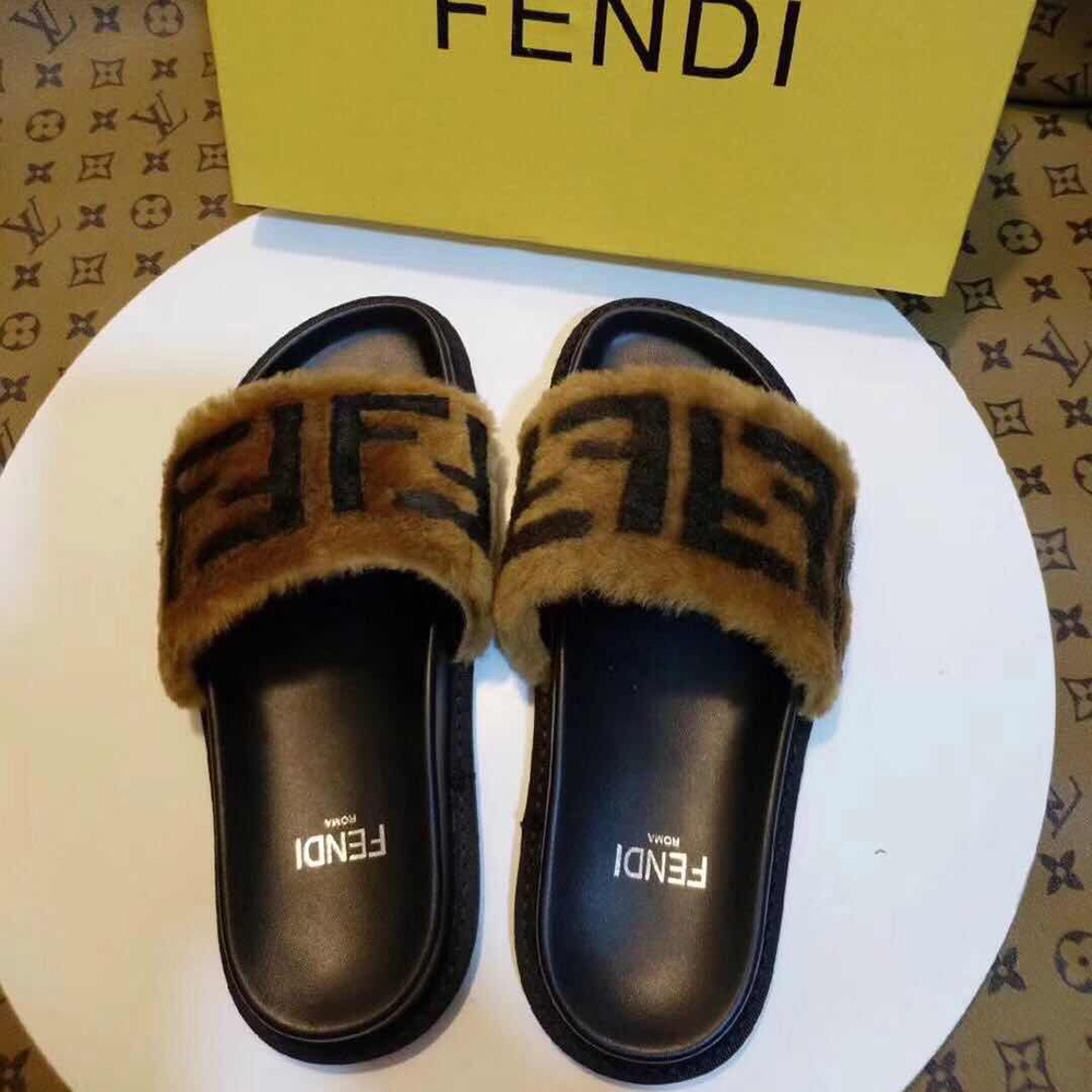 Fendi-Slides aus braunem Leder und Schaffell - EUR FASHION