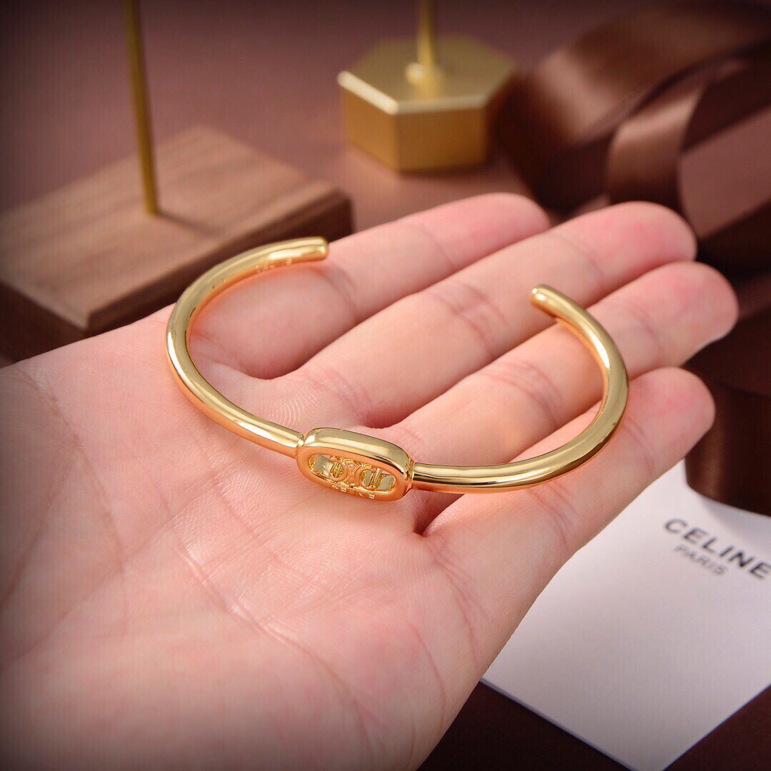 Celine Maillon Triomphe Dünne Manschette aus Messing mit Goldfinish - EUR FASHION