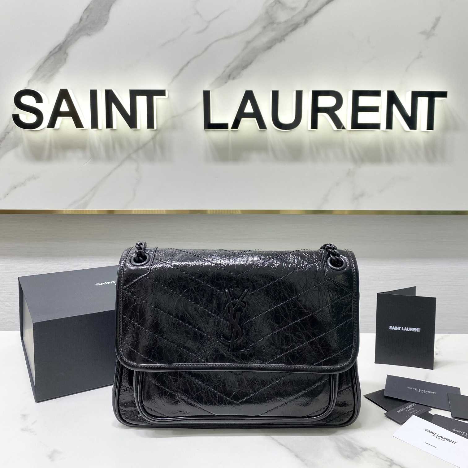 Saint Laurent Niki Mittelgroße Kettentasche aus zerknittertem Vintage-Leder - EUR FASHION