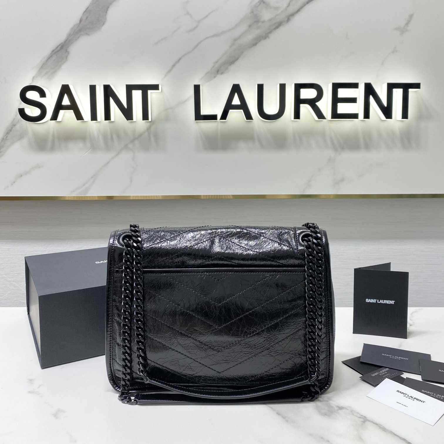 Saint Laurent Niki Mittelgroße Kettentasche aus zerknittertem Vintage-Leder - EUR FASHION