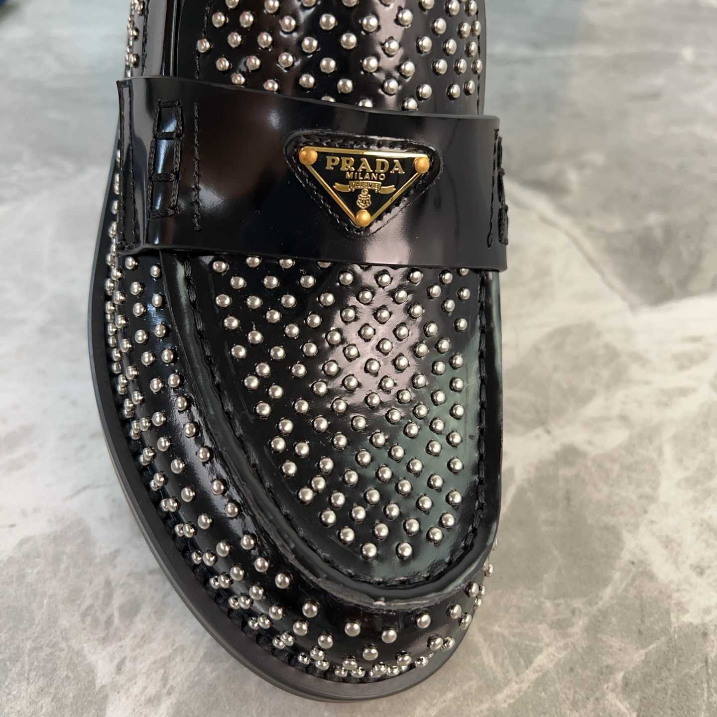 Prada Studded Brushed Leather Loafers - EUR FASHION